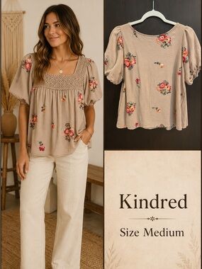 Kindred floral blouse with embroidered flowers in pink, orange, and green.